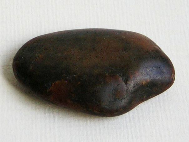 Dark brown colored jade river pebble – (9926)